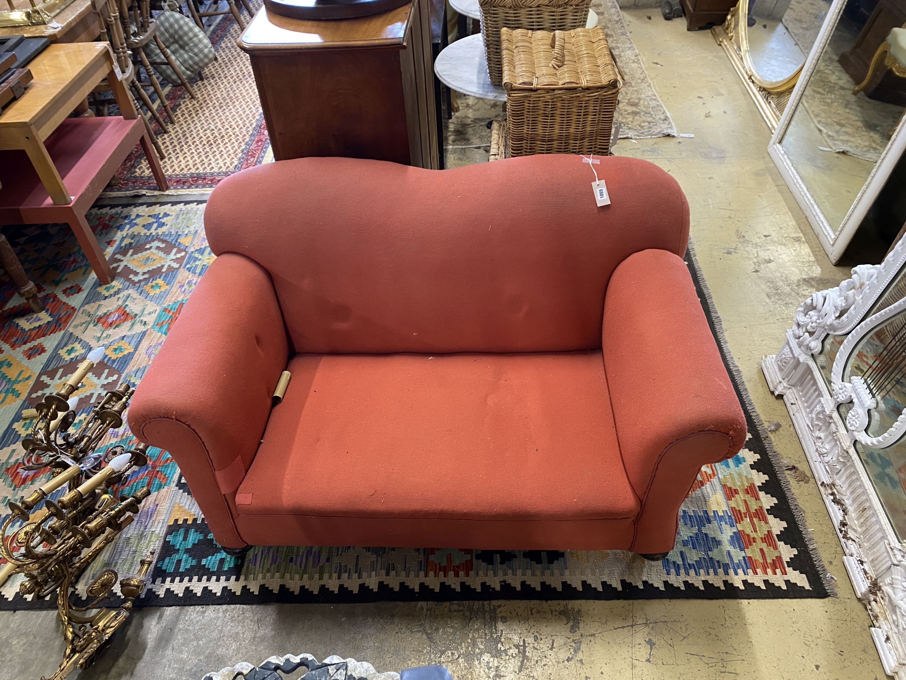 An early 20th century drop arm two seater chesterfield settee, length 136cm, depth 78cm, height 76cm